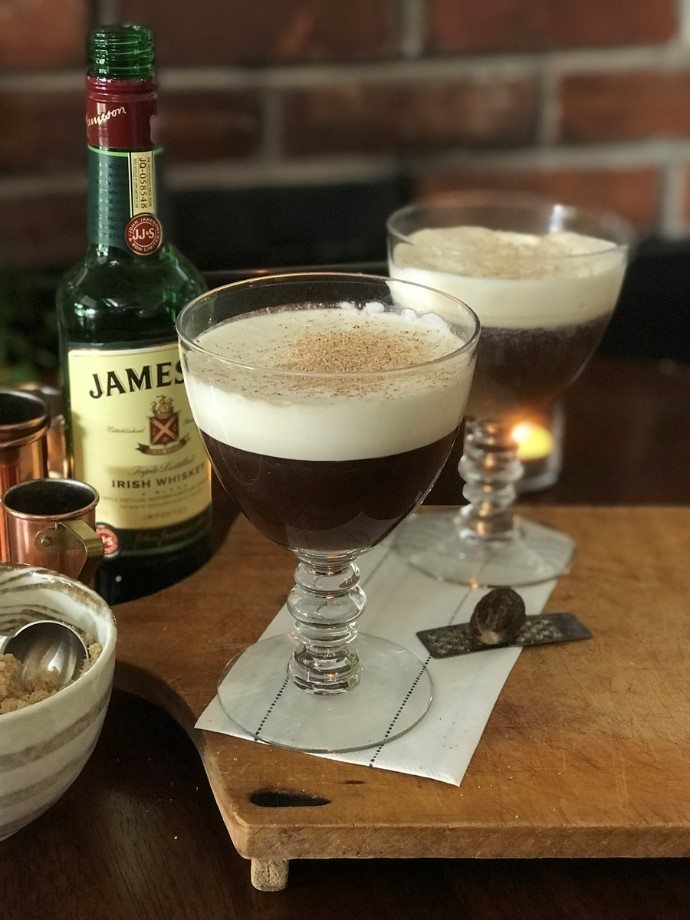Jameson bottle behind the two glasses of Irish coffee