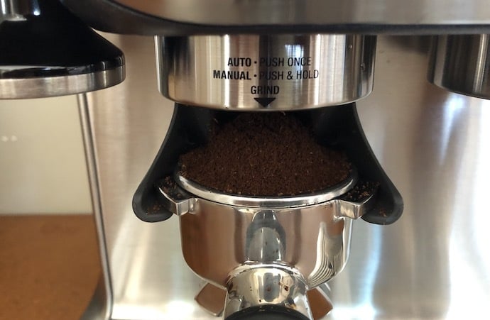 freshly ground coffee into portafilter