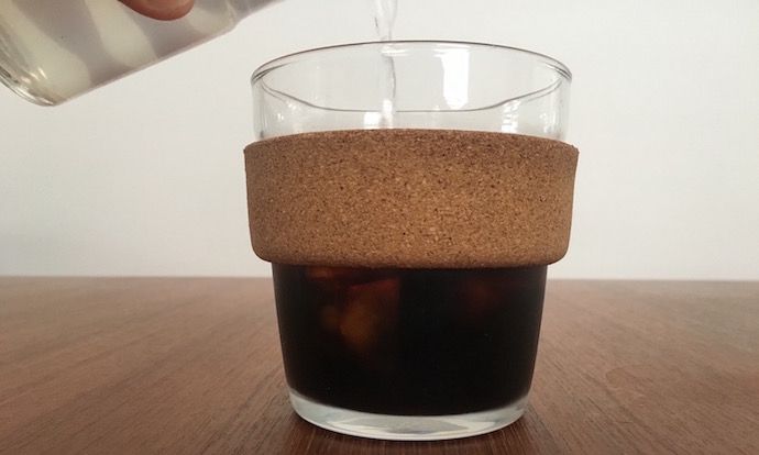 glass filled in with cold brew coffee on a table