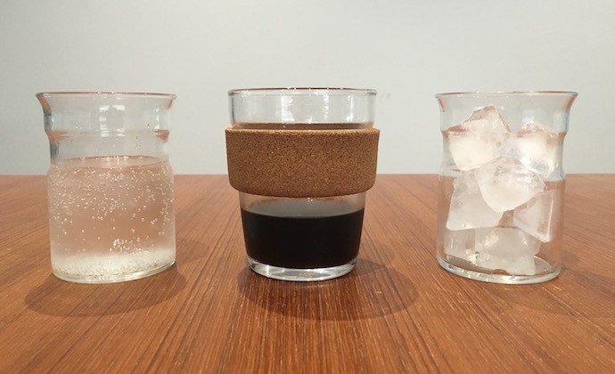 three glasses lined up and filled with tonic water, cold brew and ice cubes