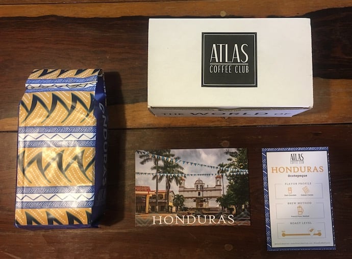coffee package, box and 2 cards on a table