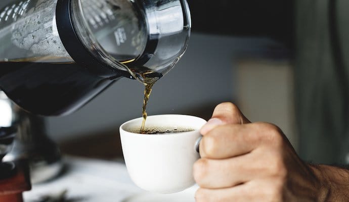 drip-coffee-being-poured-into-cup