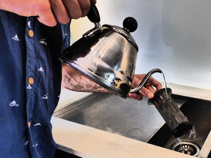 Pouring hot water to plunger