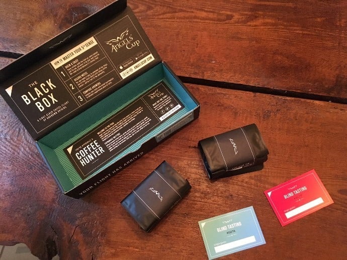 angel's cup coffee subscription box, coffee packages and cards on a table