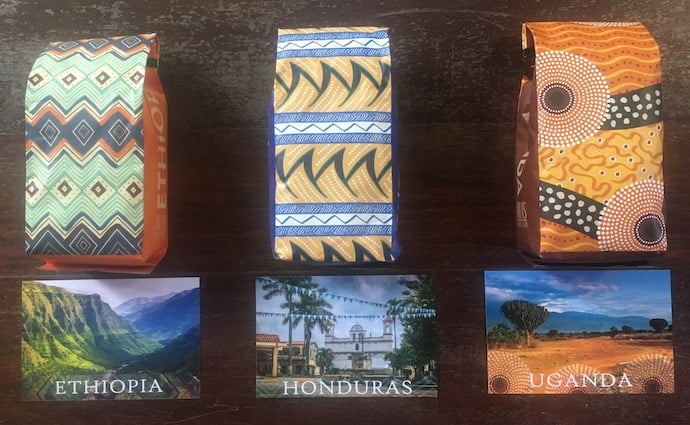coffee knowledge - three bags of coffee beans from ethiopia, honduras, and uganda