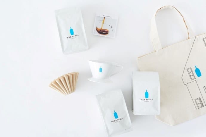 a flatlay photo of blue bottle products