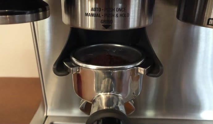 using the machine's built-in grinder