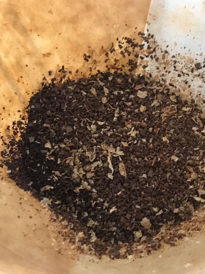 medium coarse coffee grounds on paper filter