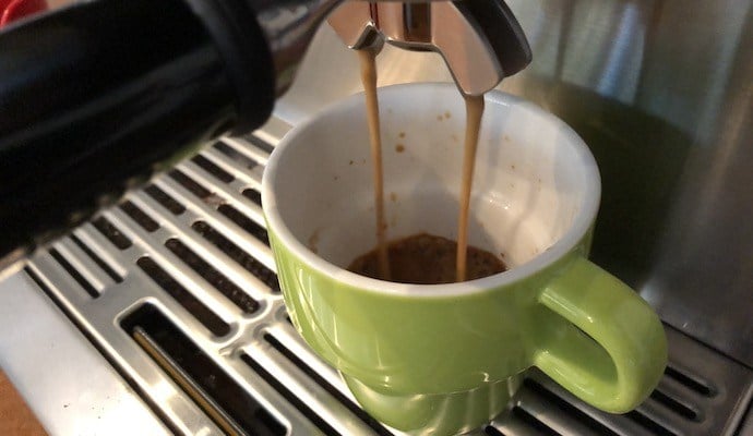 an image showing how to use an espresso machine to pull a shot