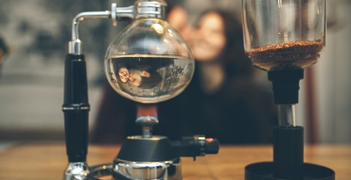 Vacuum coffee maker brewing coffee in a kitchen