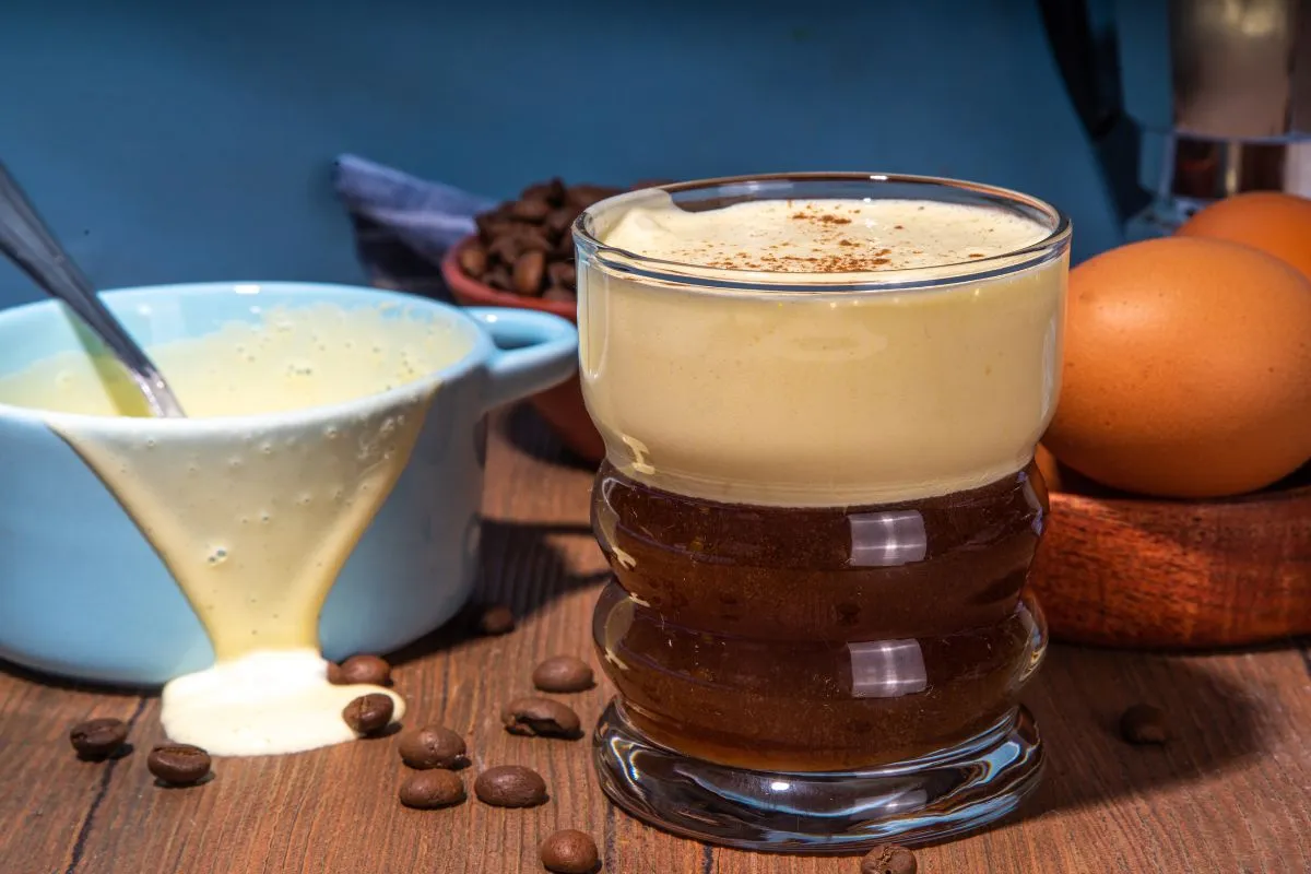 A glass of frothy Vietnamese egg coffee