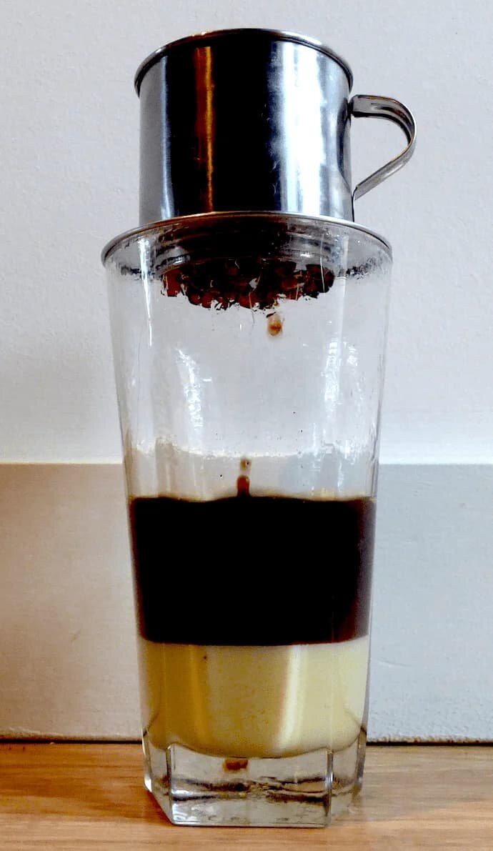 coffee dripping in a tall glass