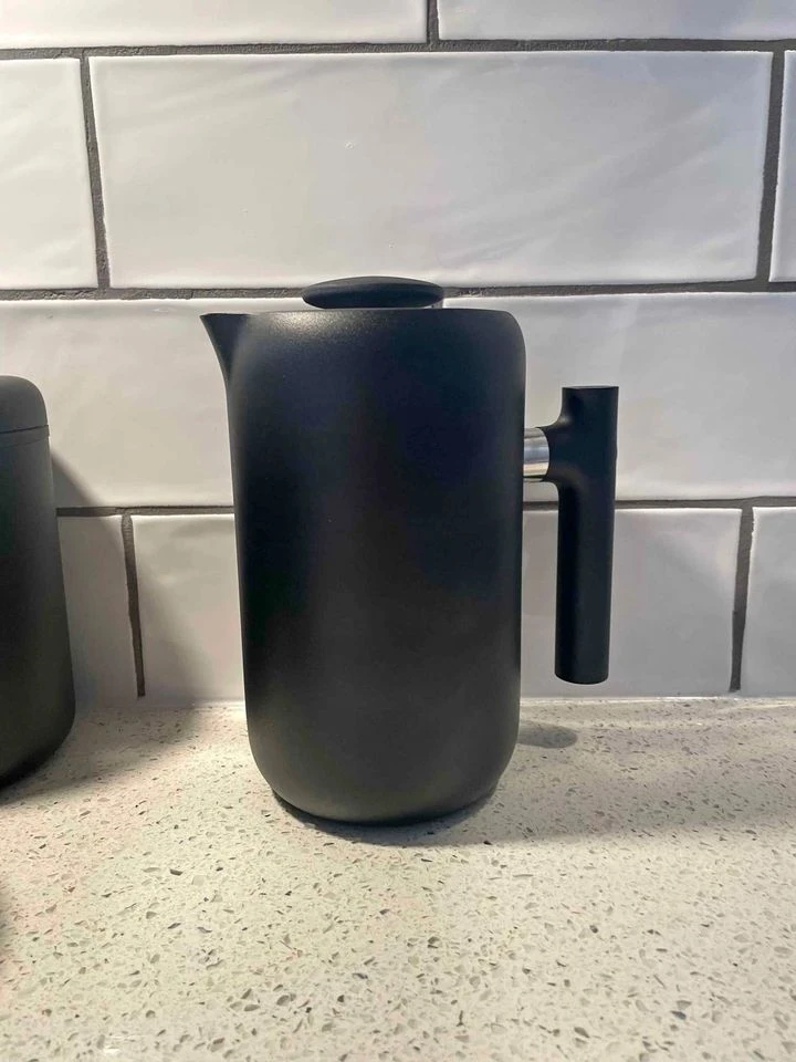 Fellow Clara French press against tile splashback