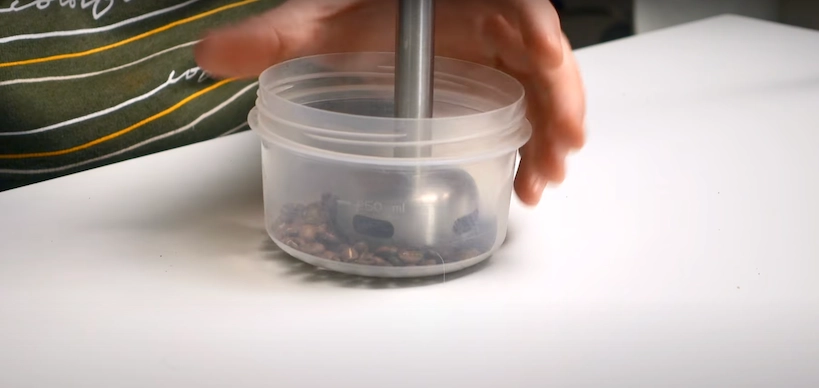 A closeup of grinding coffee with a blender