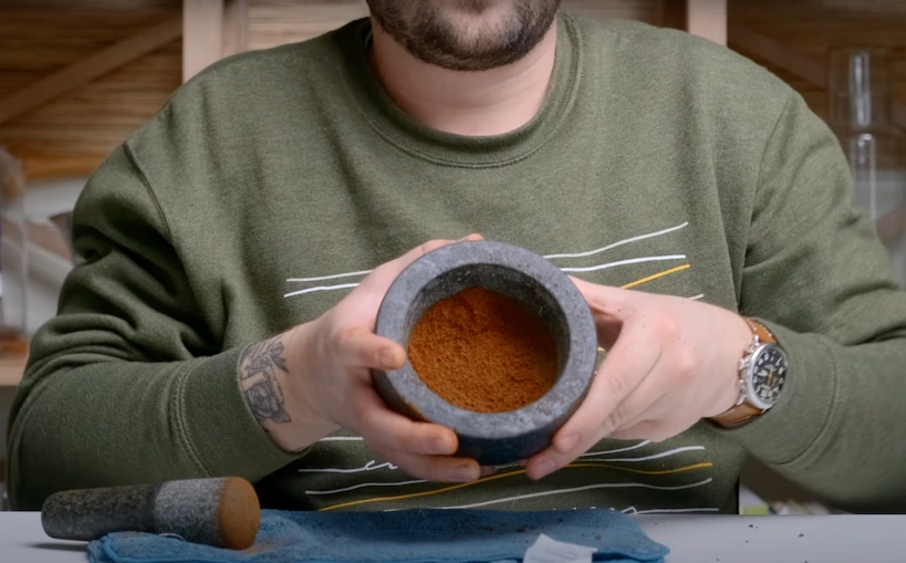 Coffee ground with the mortar and pestle