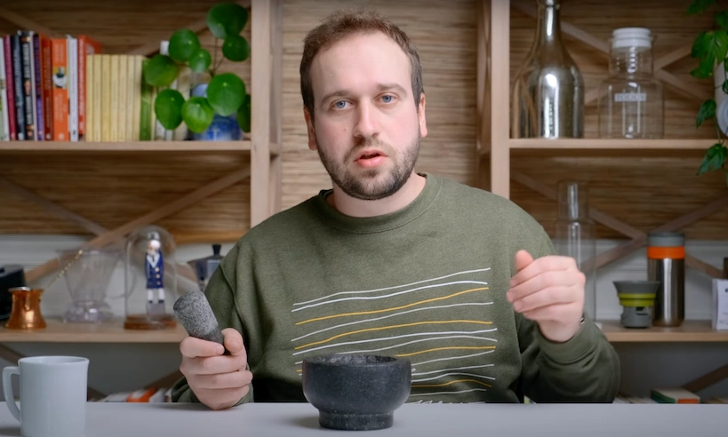 Steven presenting mortar and pestle for grinding