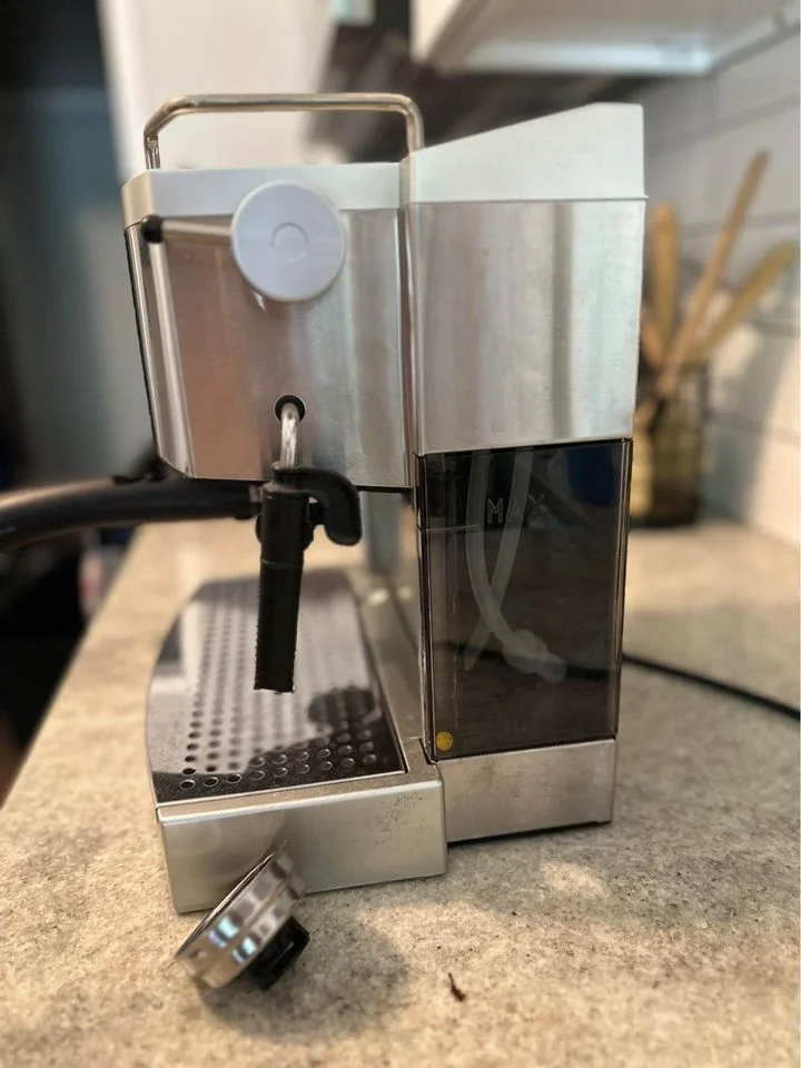 Side view of the Delonghi EC702 espresso machine