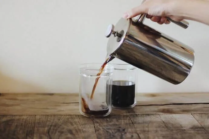 Sterling Pro French press pouring coffee into mason jar