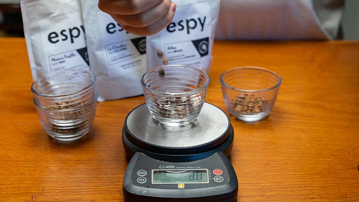 weighing the beans on a kitchen scale
