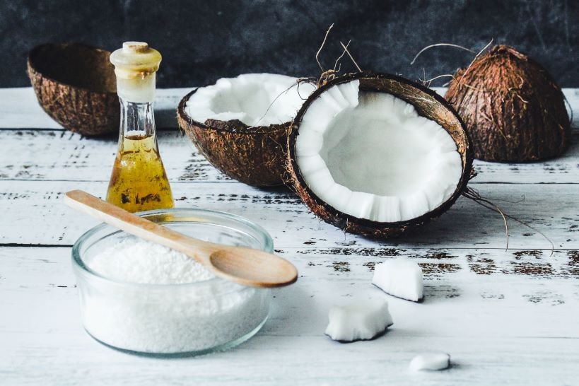 Coconut Oil with piece of Coconut