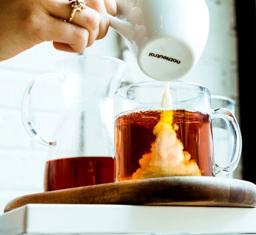 Pouring Cream in coffee