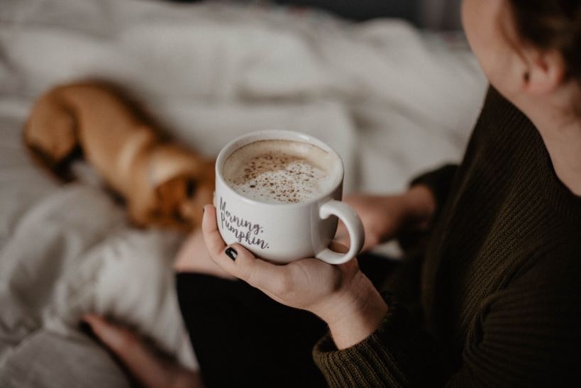 Person Holding Coffee Cup