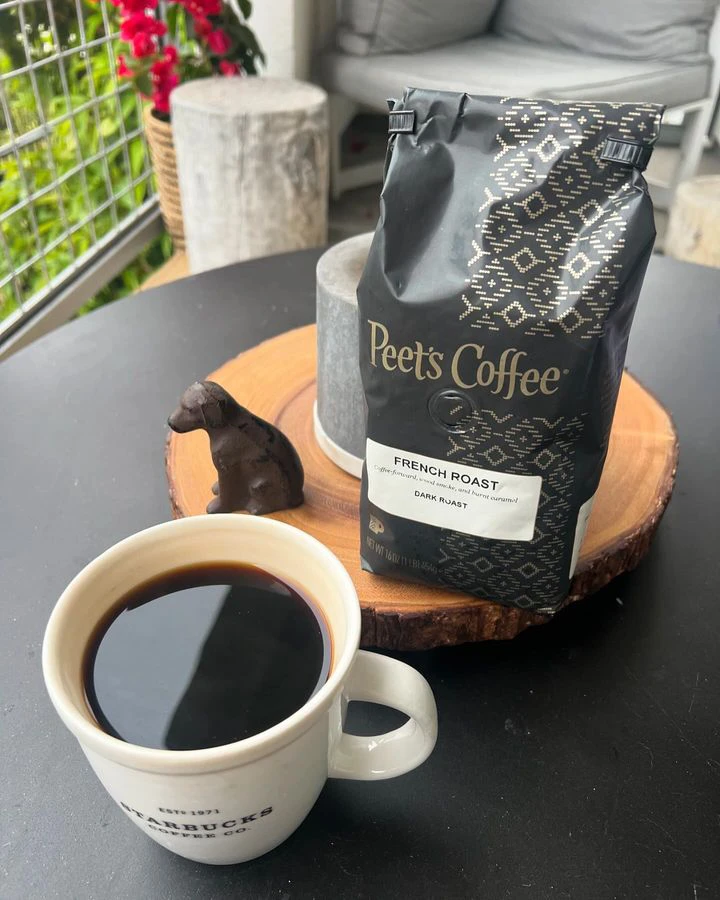 Bag of Peet's Dark Roast coffee beans and cup of coffee