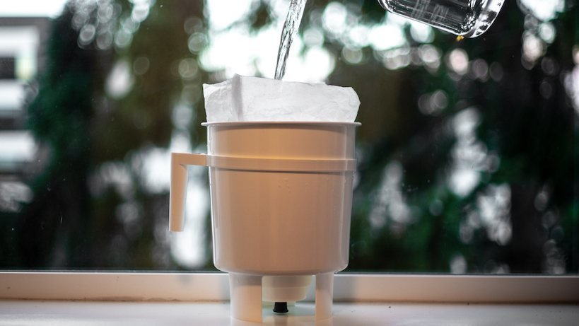 adding water to Toddy cold brew maker