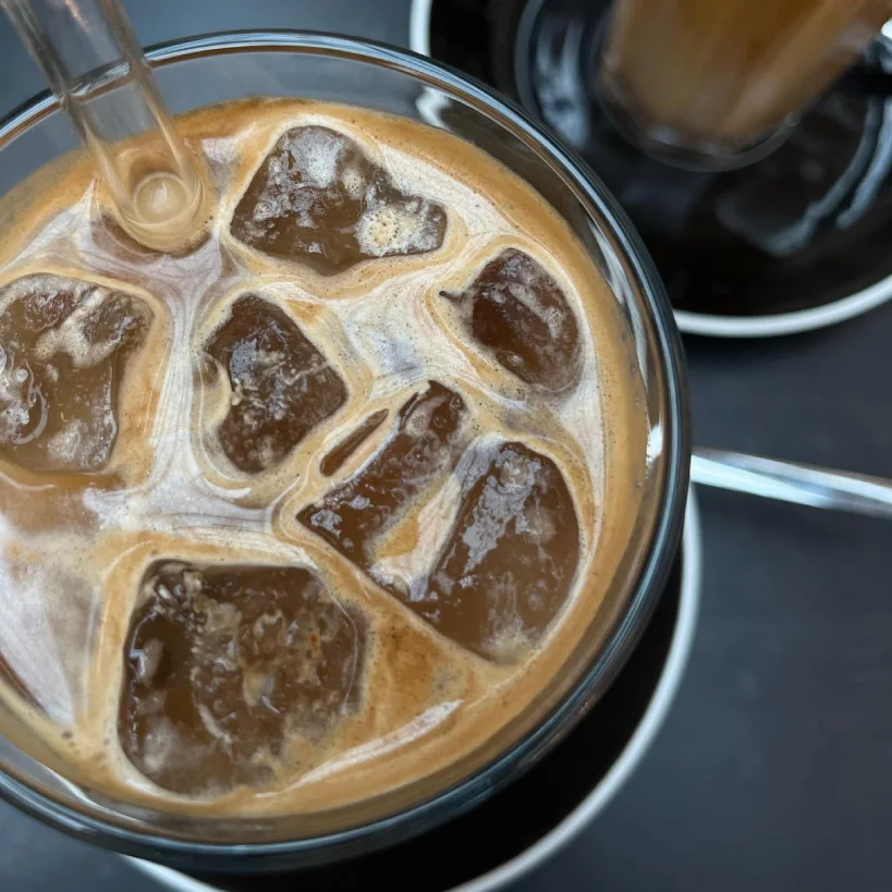 Close up of glass of iced coffee from above