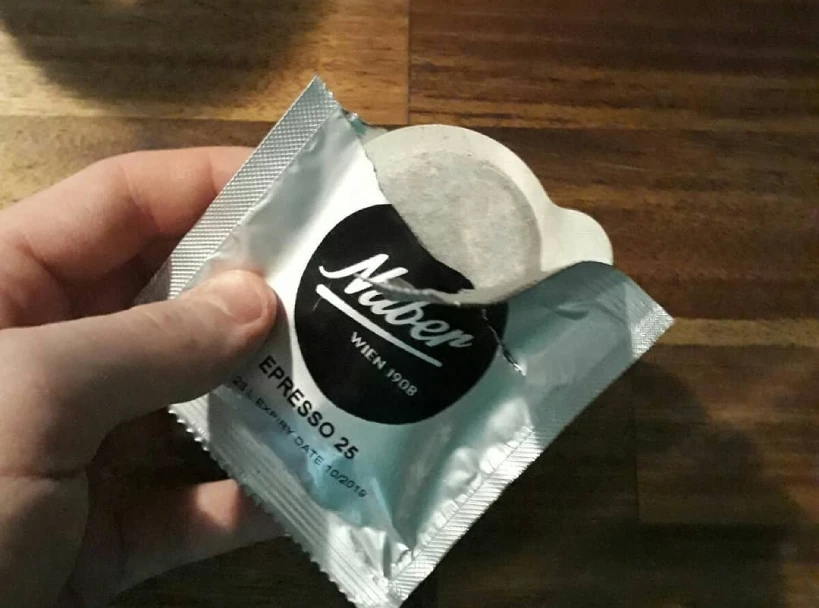 Partialy unwrapped ESE coffee pod